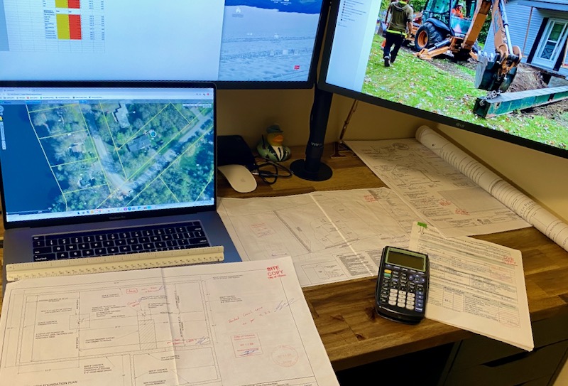 photo of laptop and construction plans